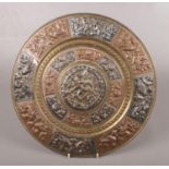 A bronze coloured Indian plaque. With foil overlay decoration. Presented by the Indian Society of