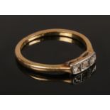 An 18ct Gold Three Stone Set Diamond Ring. Size N. Total Weight: 1.99g Condition Good, small part of