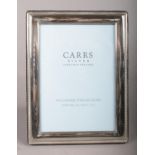 A Sterling silver photo frame, assayed in Sheffield 2003 by Carr's. 5x7inch frame. Condition fair.
