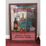 A Vintage pub advertising mirror 'Whitbread London Stout', together with a bottle of unopened