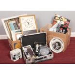 Two boxes of assorted Elvis memorabilia. Calendar, books, mugs, plates etc