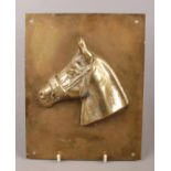 A brass horse racing plaque, Red Rum.