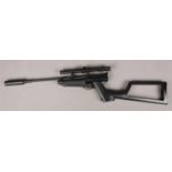 A Crosman Airguns .22cal gas powered rifle with scope.