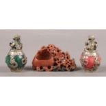 Two white metal mounted foo dog censors and a soapstone carving.