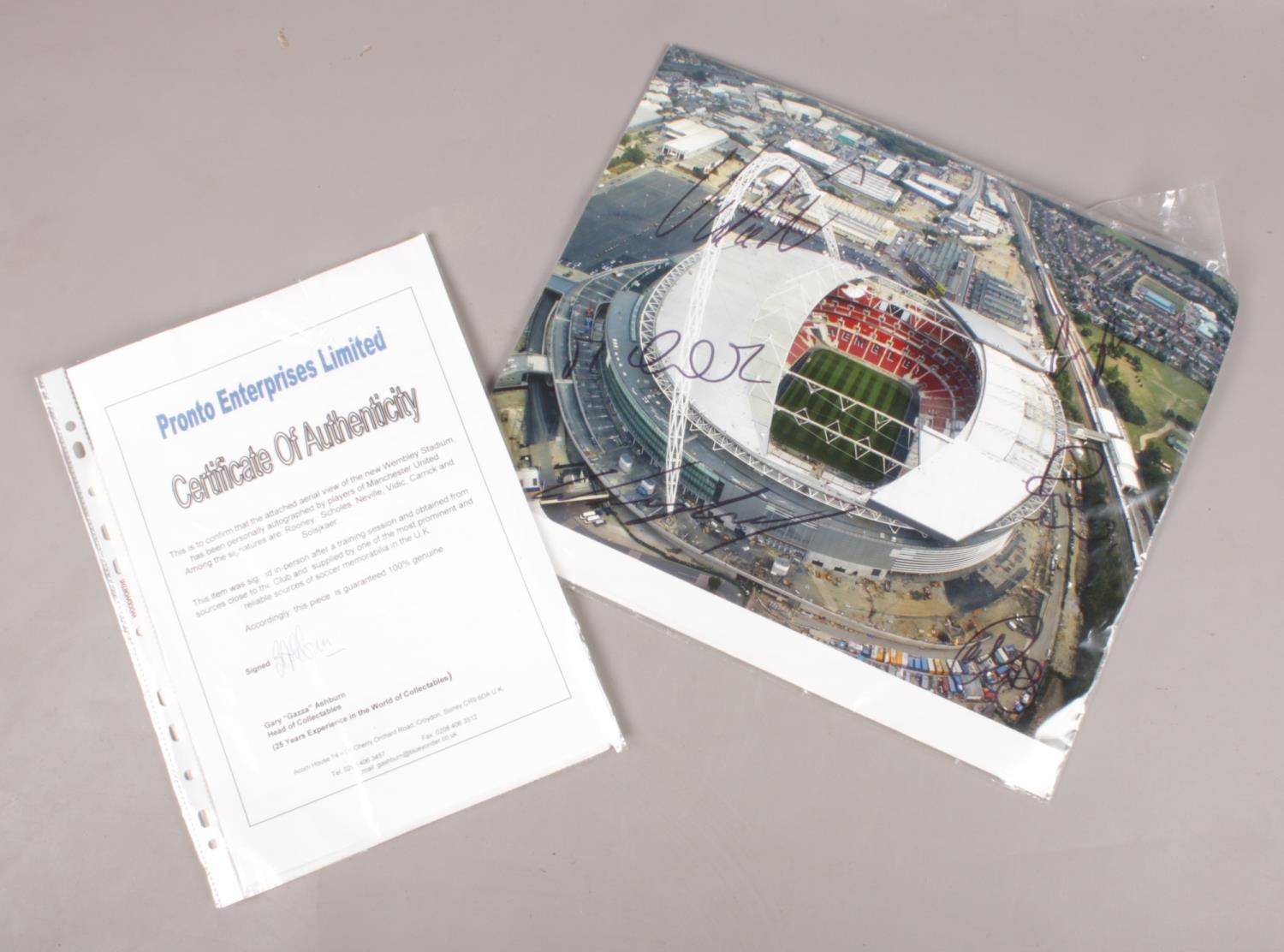 An autographed photograph of Webley Stadium. Signed by Manchester United Football Club players,