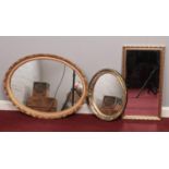 A group of three gilt mirrors. To include a large oval, rectangle and small oval. Largest: H: