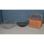 A group of three various baskets. To include a bamboo framed magazine rack, a wire basket and