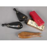 A small group of collectables. Includes Savage's shoe trees, box of dominoes and Yugoslavian