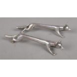 A pair of fox knife rests. Marked Silver.