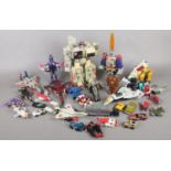 A quantity of Transformer figures/vehicles.