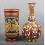 A Zsolnay reticulated vase along with a Victorian spill vase decorated with a battle scene.