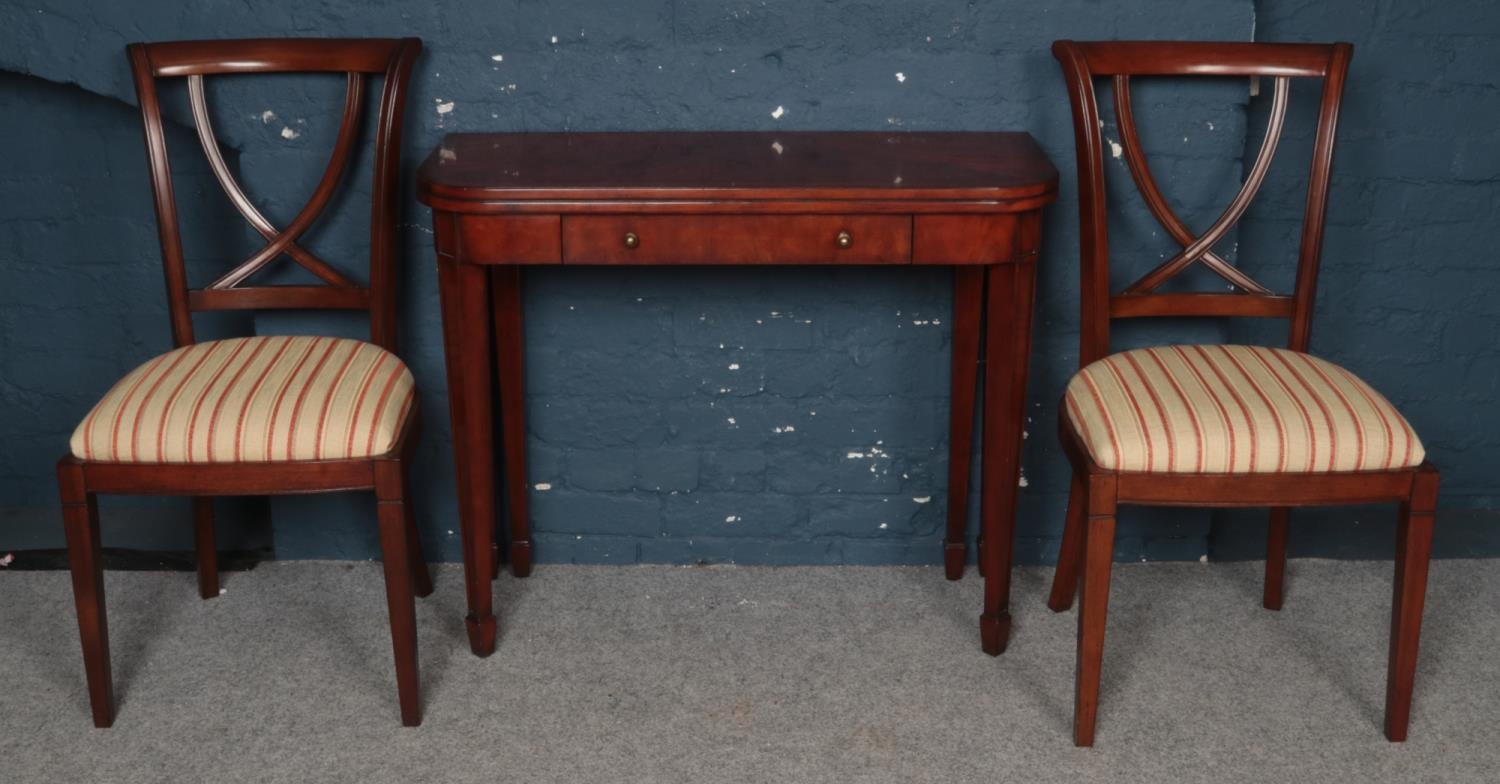 A Multiyork Mahogany Regency Style Fold-over Tea Table with Two Crossback Dining Chair.
