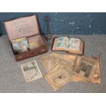 A small vintage suitcase together with a leather bound Bible & boxing magazines from 1930's.