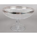 An Asprey cut glass pedestal bowl with silver rim. Assayed London 1970. Good condition.