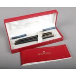 A cased Sheaffer pen set.