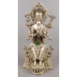 A white metal devotional figure, Guanyin. Green cabochon jewel decoration. 21cm.
