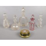 A group of five glass scent bottles together with a small trinket box. Comprising of five cut and