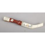 An Inuit bone hunting knife. 26cm length
