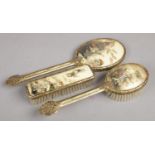 An Oriental Dressing Table Set, with Brushes and Hand Mirror.