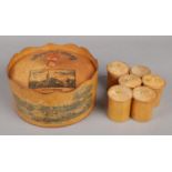A Mauchline Ware Spice Box with Six Small Lidded Jars. Decorated with Cities in Poland.