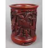 A Chinese boxwood brush pot. With carved landscape and figure decoration. Height 15.5cm.