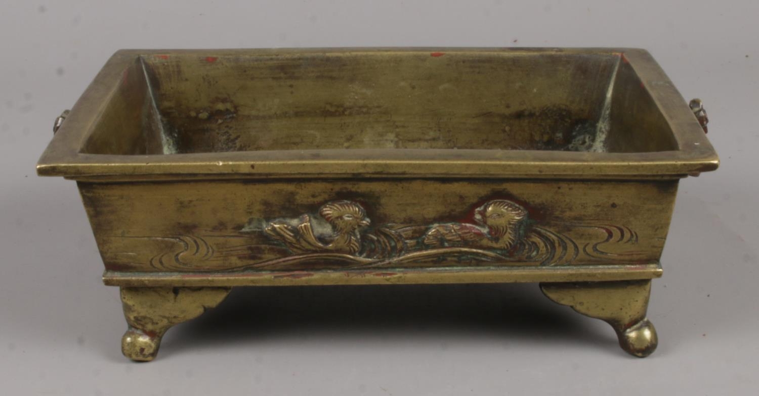 A Small Oriental Brass Tray Raised on Supports. Decorated with a River Scene on the Side of the