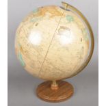 A Cram's Imperial world globe on stand. Scratches/marks to globe.