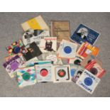 A collection of records and a Verdi's Requiem songbook. Mainly single records, includes The Beatles,