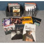 Two boxes of LP records. Including rock, pop, ACDC, Bowie, Pink Floyd, Beatles, etc.