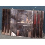 A copper coloured glass wall mirror. (51cm x 81cm)