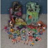 A quantity of He-Man toys. Including fortresses, figurines, etc.