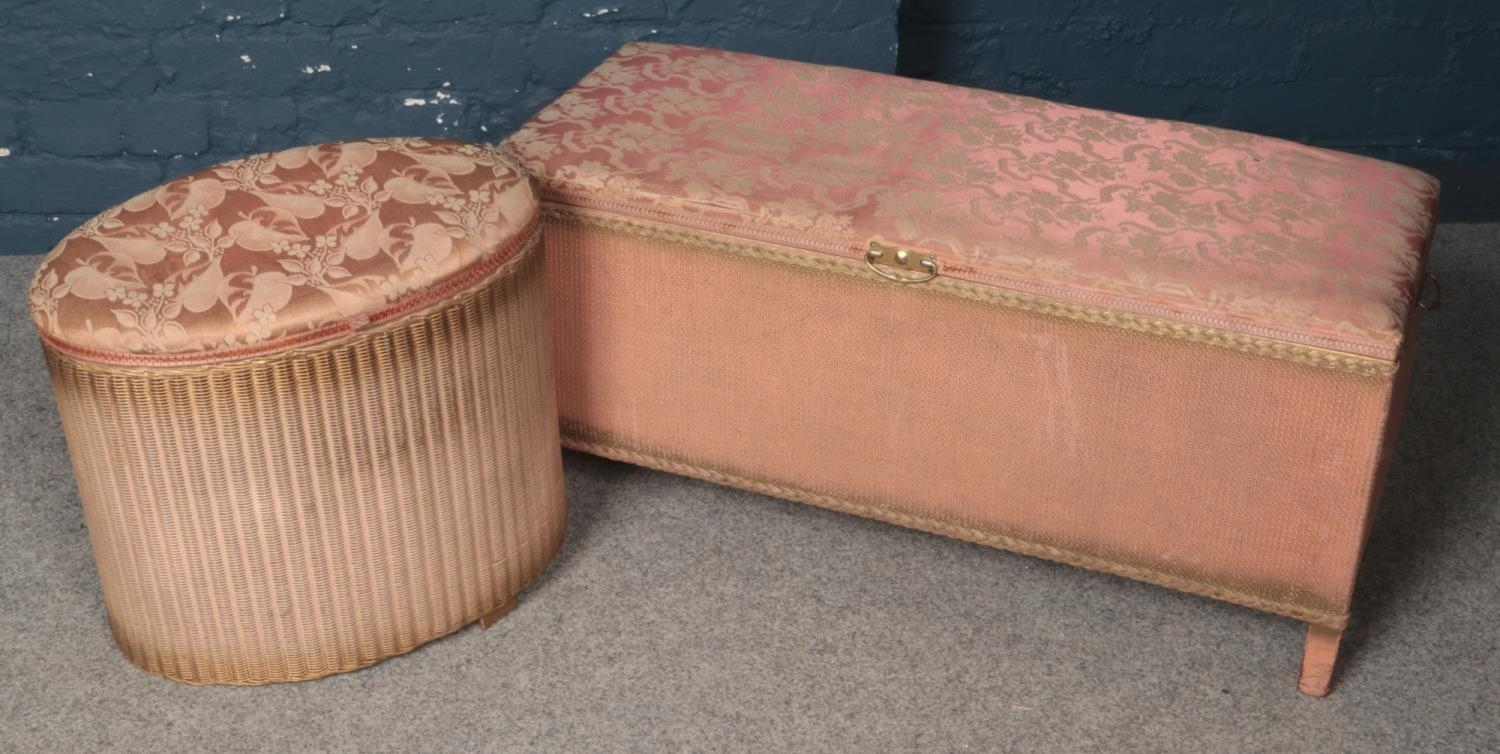 A pink Lloyd Loom blanket box along with a similar example.