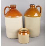 Two large stoneware flagons together with a stoneware pot. To include a J Pearson of Chesterfield