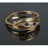 A 18ct gold sapphire & diamond ring. Size O, 2.95g.