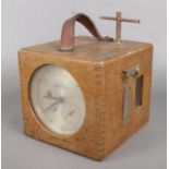 A Benzing oak cased pigeon racing clock.