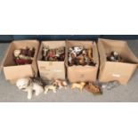 Four boxes of ceramic and composite figures, mainly animals.