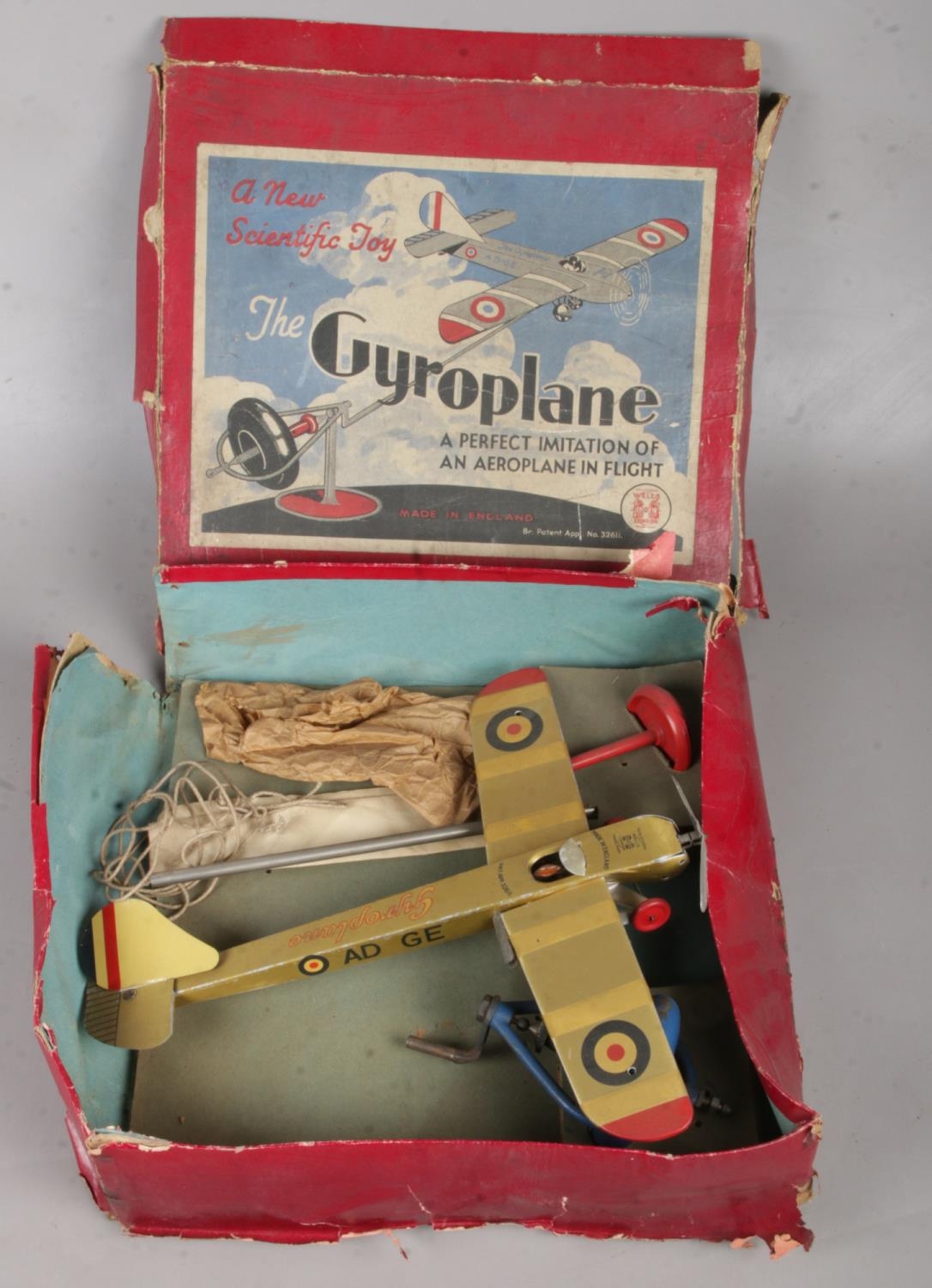 A boxed Well's tin plate Gyroplane.