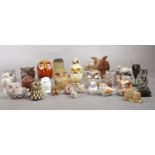 A group of assorted owl figures.