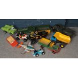A box of toy vehicles. Including Tonka truck, speedboat, wooden trains, etc.