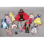 A collection of Disney Porcelain dolls. Snow White, Jasmine, Aladdin, Belle etc.