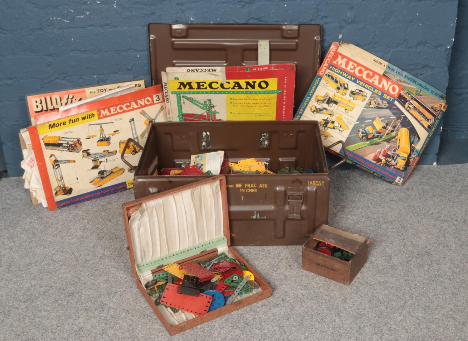 An ammunition crate containing a quantity of vintage Meccano. Meccano vehicles set, Outfit No. 3