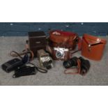 A group of vintage camera's & binoculars. Argus M3 cinetronic camera, Frankarette Prontor SVS, cased