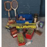 A quantity of toys and games. Including Alligator game, vintage tennis rackets, boxed Oval