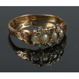 An antique 15ct gold seed pearl & green stone ring, Size O. 1.62g.