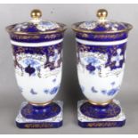 A Large Pair of Roselle Occ & Co Staffordshire Lidded Urns. Height 52cm. Overall good condition.