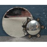 An ornate convex mirror along with another mirror. Slight chip to larger mirror.