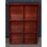 A Stained Oak Shelving Unit with Six Compartments.