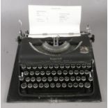 A Cased Imperial Model T Typewriter. Typewriter is coloured in matt black with Royal Crest to the