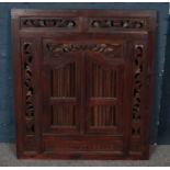 A large carved mahogany mirror/picture frame with opening doors. (90cm x 80cm)