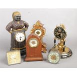 A quantity of clocks. Including torsion clock, miniature clock examples, etc.
